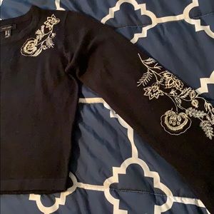 Black sweater with white embroidery